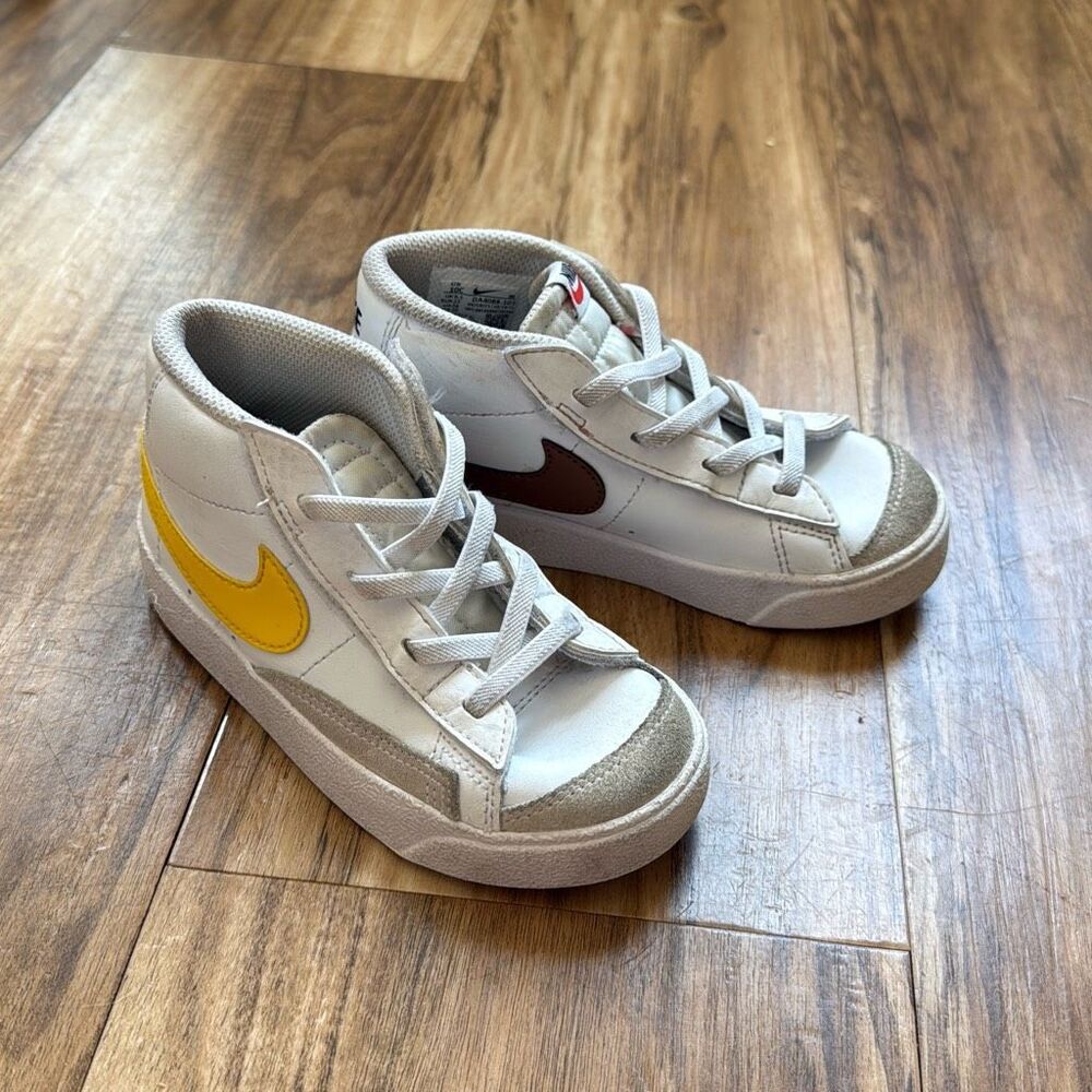 Nike Kids White Sneakers with Yellow and Brown Swooshes